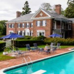 Tour a stately mansion in Water Mill, New York that sits on five spacious acres of waterfront land