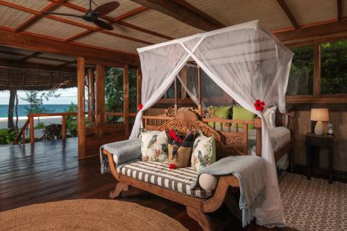 The island’s beach bandas are furnished with locally made, hand-carved furnishings and fabrics from neighboring Mafia Island