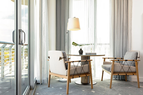 A guest room sitting area at Kimpton Hotel Palomar South Beach