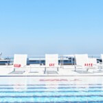 The property's iconic pool deck has been transformed with 1960s style decor