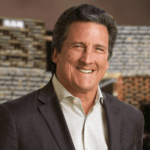 Under the leadership of Bill Hornbuckle, MGM Resorts International continues to redefine hospitality and entertainment. With the success of BetMGM, LeoVegas, and a $3 billion top-line digital business in partnership with Entain, Hornbuckle is steering MGM into a new era of innovation while maintaining its legacy of world-class experiences.
