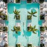 Explore Four Seasons Resort and Residences Anguilla, a beachfront haven featuring luxurious accommodations and vibrant tropical surroundings