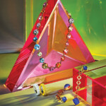 A colorful array of stones garnish sculptural cuffs, architectural pendants and amplified earrings